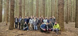 Workshop participants in a forest.